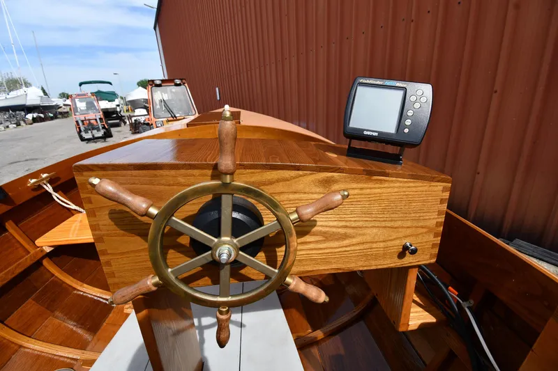 Slide: The Image of Wooden helm of 2003 Great Lakes 16 Skiff with navigation device. - 12