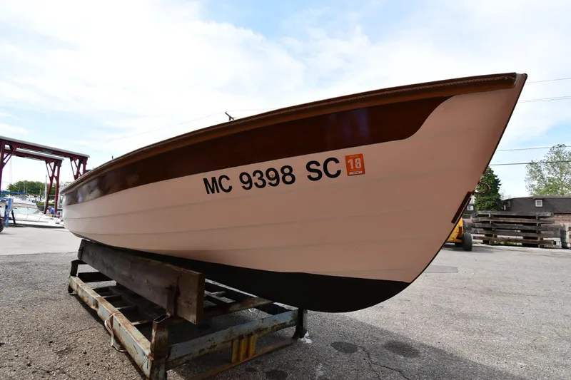Slide: The Image of 2003 Great Lakes 16 Skiff boat on trailer, registration MC 9398 SC, outdoor setting. - 2