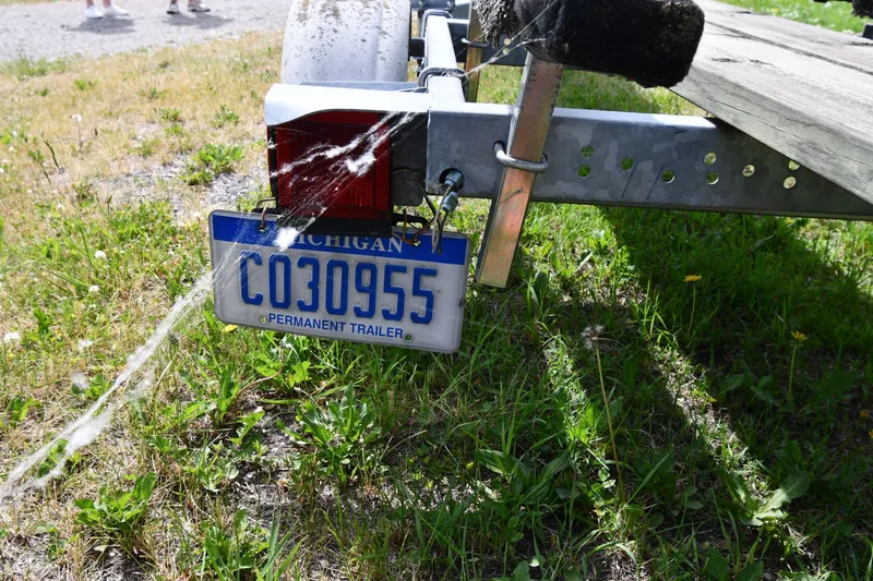 Slide: The Image of Trailer with Michigan license plate, CO30955, attached to a Great Lakes 16 Skiff, 2003 model. - 20