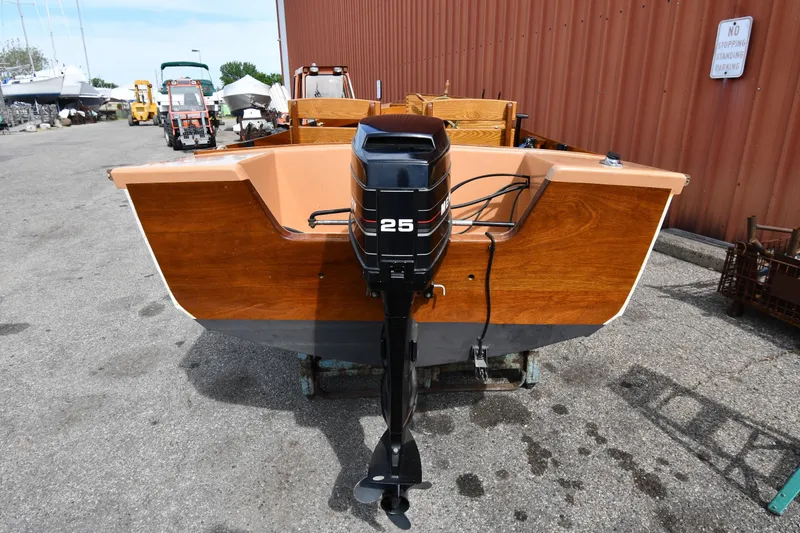 Slide: The Image of 2003 Great Lakes 16 Skiff boat with 25 HP outboard motor, docked outdoors. - 3