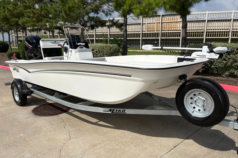 Slide: The Image of 2026 Mako Pro Skiff 17 CC boat on trailer, parked outdoors. - 3