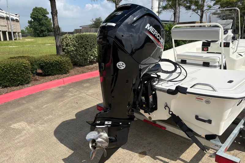 Slide: The Image of 2026 Mako Pro Skiff 17 CC with Mercury outboard motor on trailer. - 6