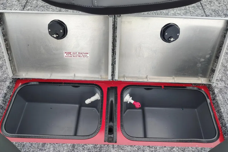 Slide: The Image of 2026 Tracker Pro Team 195 livewell compartments with pump-out feature and recirculation nozzles. - 2