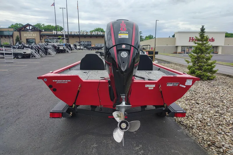 Slide: The Image of 2026 Tracker Pro Team 195 boat with outboard motor in dealership lot. - 6