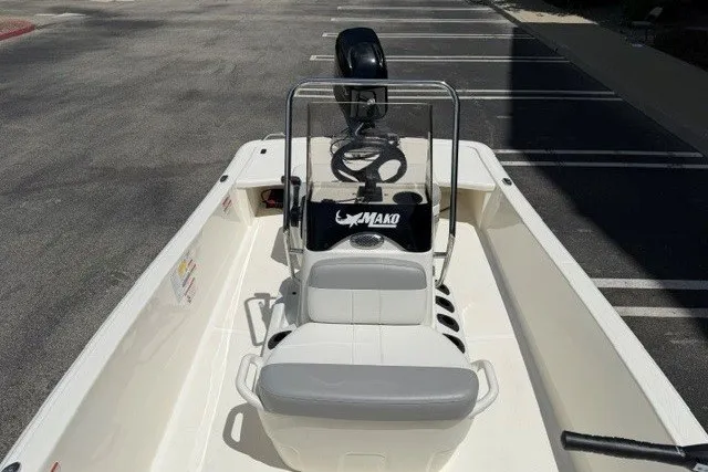 Slide: The Image of 2026 Mako Pro Skiff 15 CC boat interior with steering console and seating. - 6