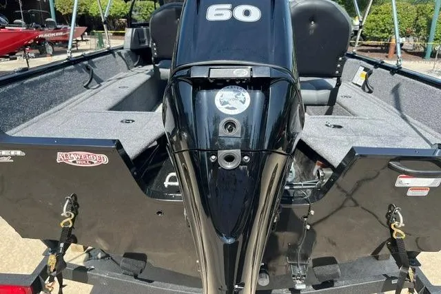 Slide: The Image of 2026 Tracker Pro Guide V-16 WT boat with 60 HP engine, rear view. - 4