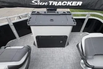 Slide: The Image of 2026 Sun Tracker SportFish 20 DLX boat interior with seating and storage area. - 3