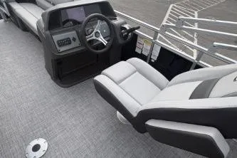 Slide: The Image of 2026 Sun Tracker SportFish 20 DLX boat interior with steering wheel and seating. - 4