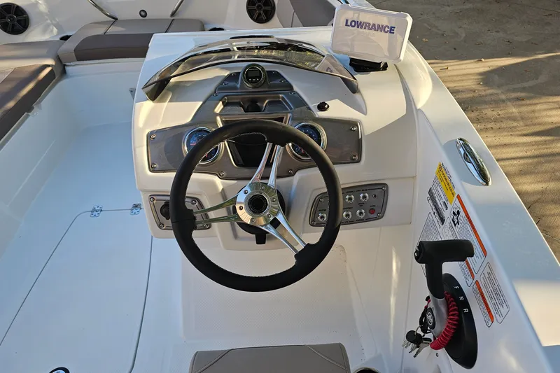 Slide: The Image of Steering console of a 2026 Tahoe 1950 boat with navigation equipment. - 9