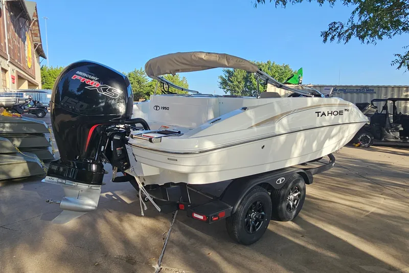 Slide: The Image of 2026 Tahoe 1950 boat with Mercury Pro XS engine on trailer. - 5