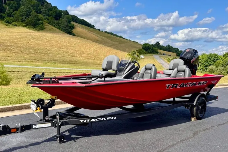 Slide: The Image of Red 2026 Tracker Pro Team 195 boat on trailer, scenic countryside background. - 3