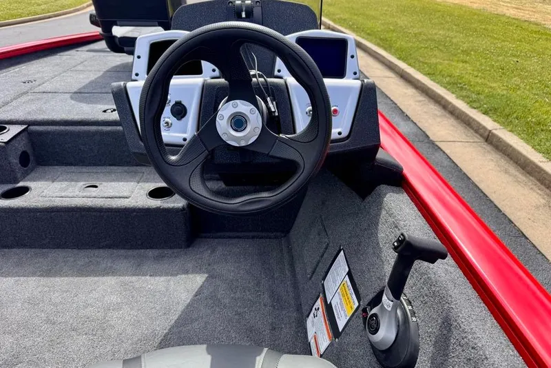 Slide: The Image of 2026 Tracker Pro Team 195 boat cockpit with steering wheel and control panel. - 8