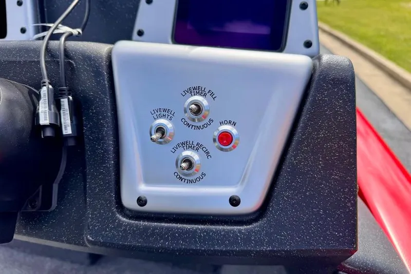 Slide: The Image of Control panel of 2026 Tracker Pro Team 195 boat with livewell and horn switches. - 12