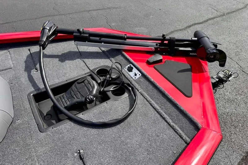 Slide: The Image of 2026 Tracker Pro Team 195 boat deck with trolling motor and foot pedal controls. - 10