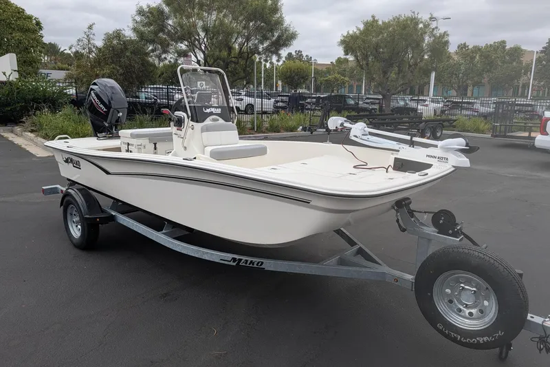 The Image of 2026 Mako Pro Skiff 15 CC boat on trailer, parked outdoors. - 0
