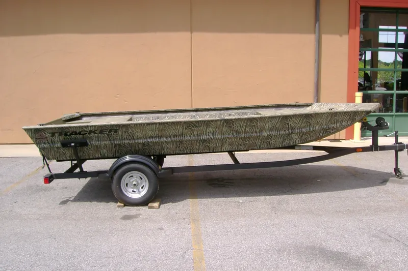 The Image of 2026 Tracker Grizzly 1754 Utility boat on trailer, parked outdoors. - 0