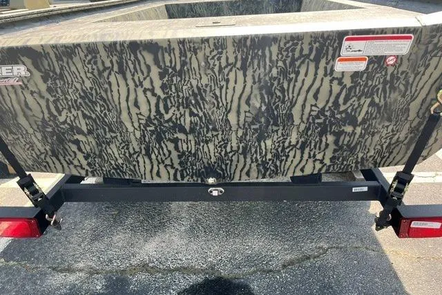 Slide: The Image of 2026 Tracker Grizzly 1754 Utility boat with camouflage pattern and trailer. - 9