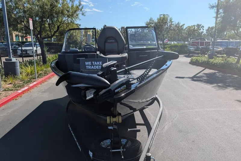 The Image of 2026 Tracker Pro Guide V-175 Combo boat on trailer, outdoor dealership setting. - 0