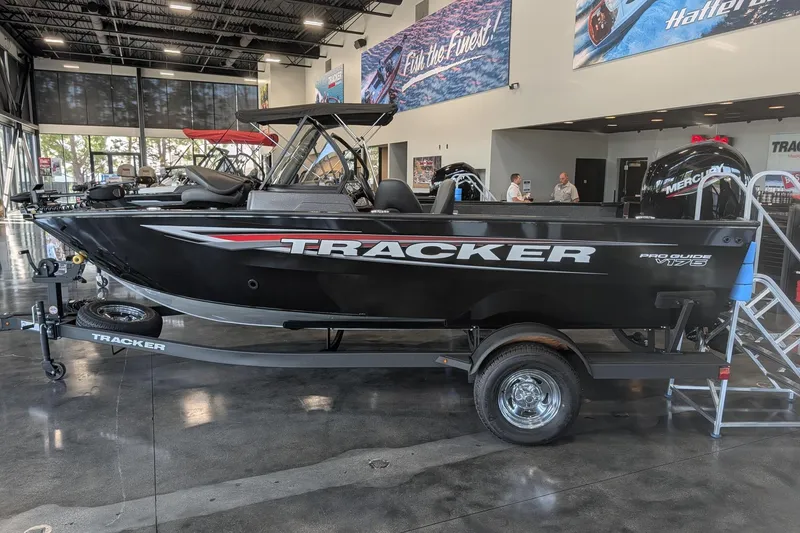 Slide: The Image of 2026 Tracker Pro Guide V-175 Combo boat interior with seating and dashboard. - 10