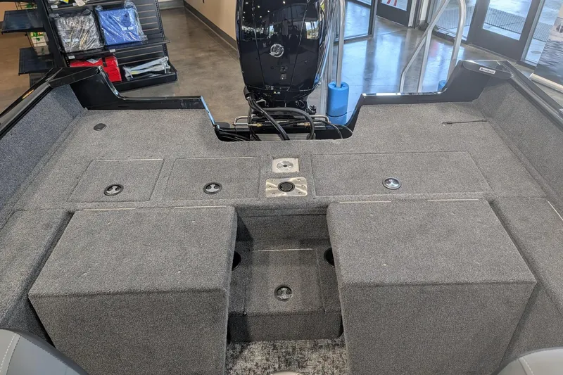 Slide: The Image of Interior view of 2026 Tracker Pro Guide V-175 Combo boat cockpit with steering wheel and controls. - 15