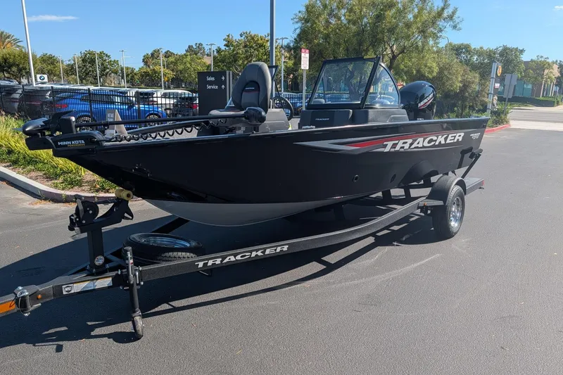 Slide: The Image of 2026 Tracker Pro Guide V-175 Combo boat with 150 HP engine in showroom. - 7