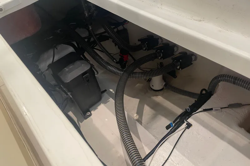 Slide: The Image of 2026 Mako 226 Center Console boat wiring and battery compartment. - 6