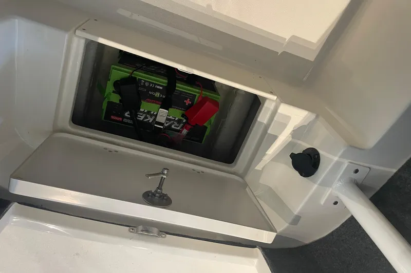 Slide: The Image of Battery compartment of 2026 Mako 226 Center Console boat, featuring secure storage. - 3
