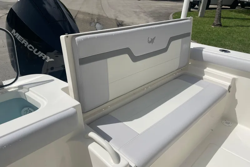 Slide: The Image of 2026 Mako 226 Center Console boat with cushioned seating and Mercury engine. - 13