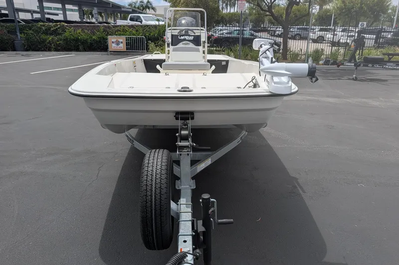 Slide: The Image of 2026 Mako Pro Skiff 17 CC boat on trailer in parking lot. - 3