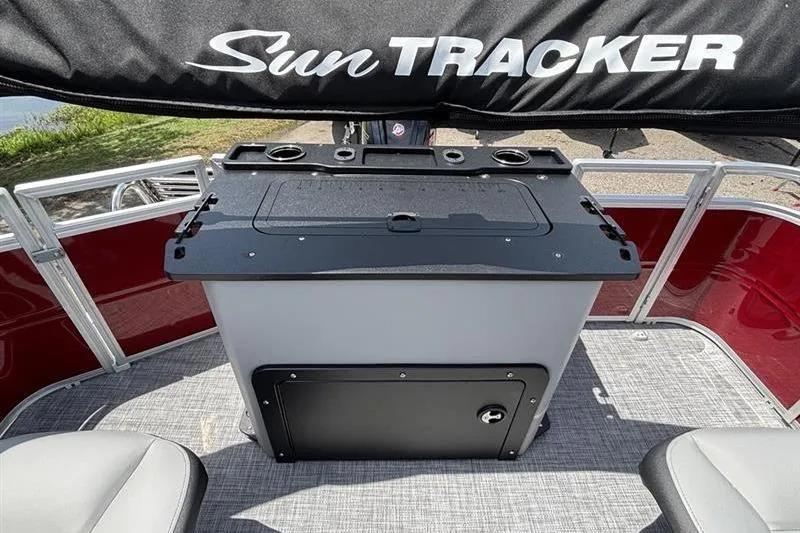 Slide: The Image of 2026 Sun Tracker SportFish 20 DLX boat interior with seating and storage area. - 16