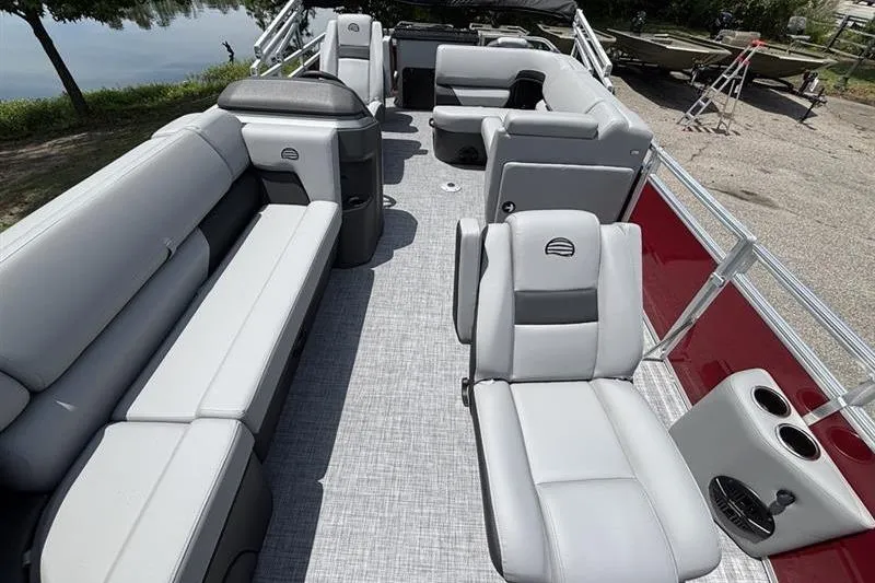 Slide: The Image of 2026 Sun Tracker SportFish 20 DLX pontoon boat with spacious seating and modern design. - 5