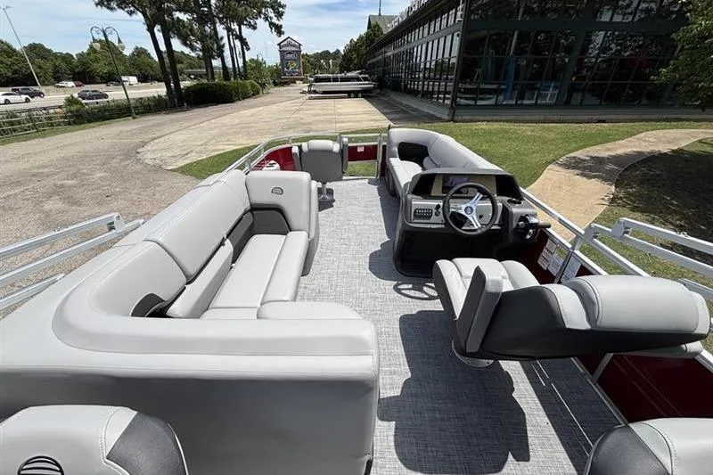 Slide: The Image of 2026 Sun Tracker SportFish 20 DLX pontoon boat with spacious seating and modern helm. - 7