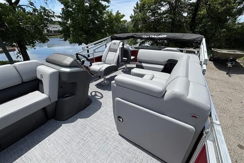 Slide: The Image of 2026 Sun Tracker SportFish 20 DLX pontoon boat with spacious seating and modern design. - 9