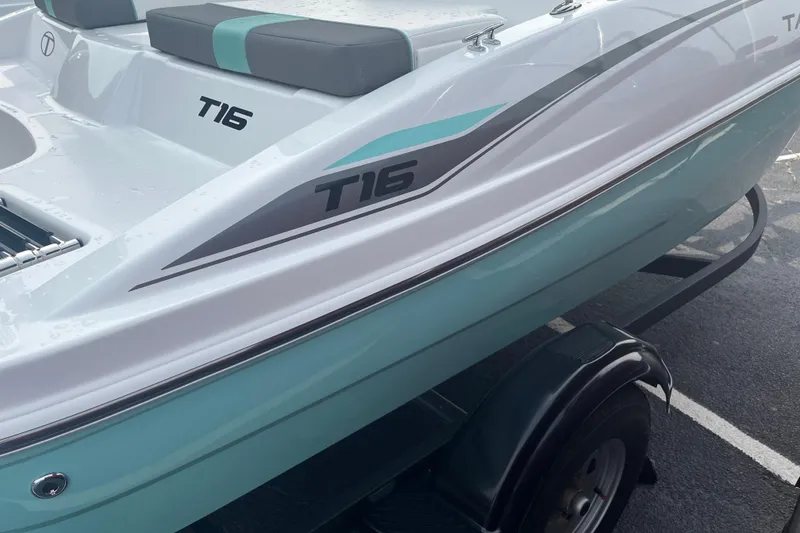Slide: The Image of 2026 Tahoe T16 boat with sleek design and modern seating on a trailer. - 5