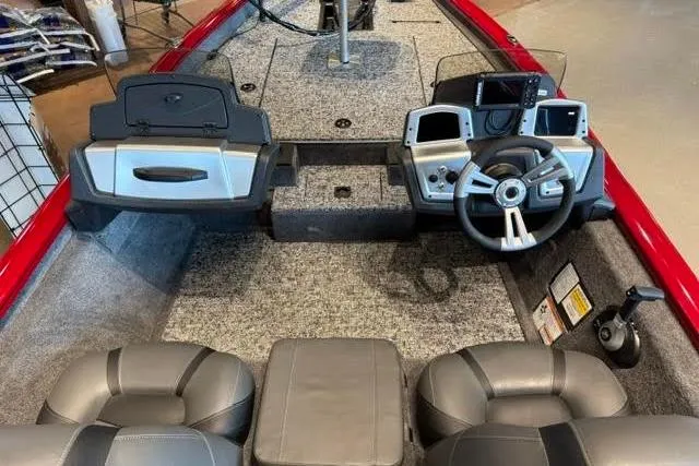 Slide: The Image of Interior of 2026 Tracker Pro Team 175 boat with steering console and seating. - 3