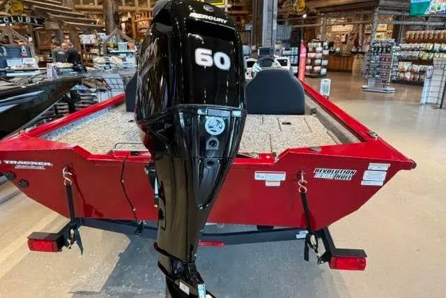 Slide: The Image of 2026 Tracker Pro Team 175 boat with Mercury 60 engine displayed indoors. - 4