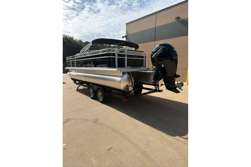 Slide: The Image of 2026 Sun Tracker Fishin' Barge 22 DLX pontoon boat with Mercury outboard motor. - 100