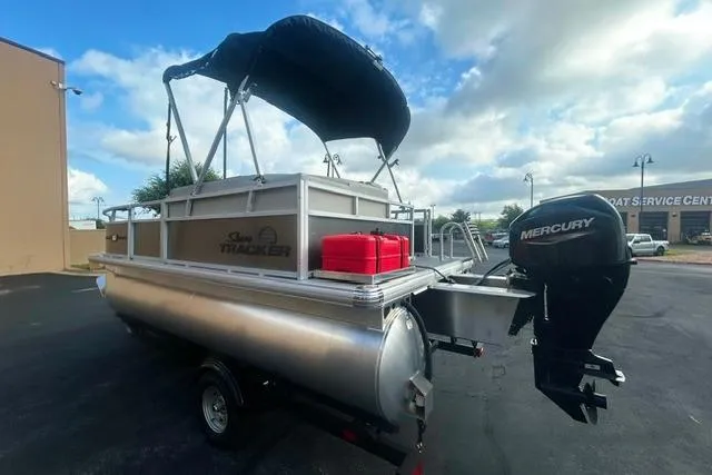 Slide: The Image of 2026 Sun Tracker Bass Buggy 16 XL Select pontoon boat with Mercury outboard motor. - 3
