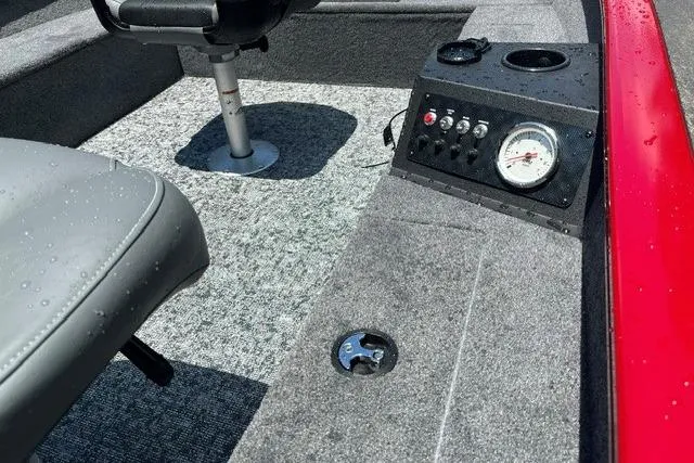Slide: The Image of Interior of 2026 Tracker Super Guide V-16 T boat with control panel and seating. - 7