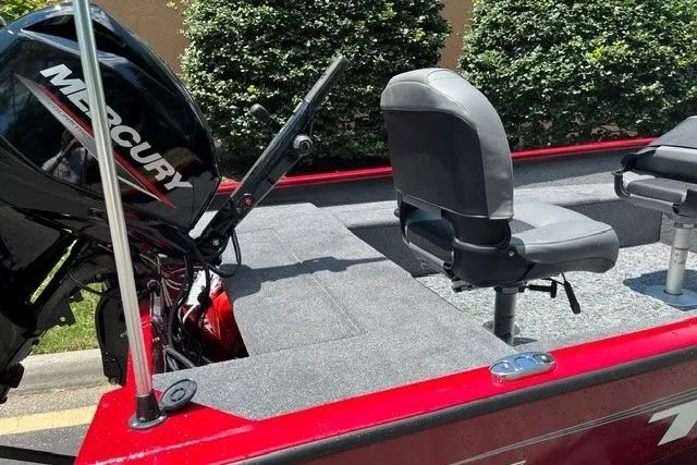 Slide: The Image of Red Tracker Super Guide V-16 T boat, 2026 model, with Mercury engine and seating. - 6