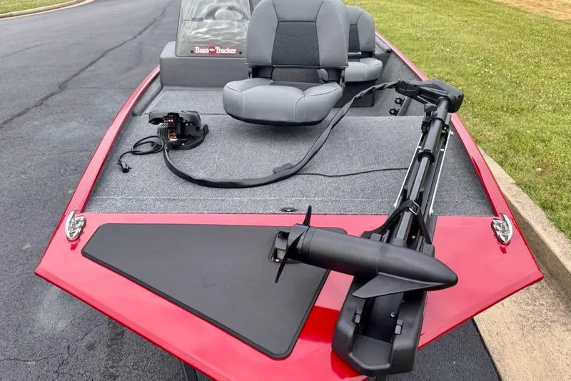 Slide: The Image of 2026 Tracker Bass Tracker Classic XL boat with red deck and gray seating. - 4