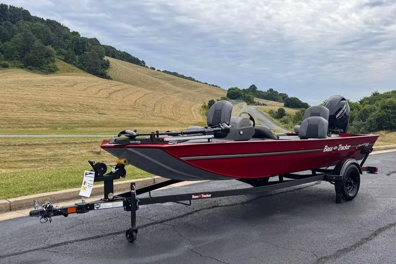 Slide: The Image of 2026 Tracker Bass Tracker Classic XL boat on trailer, scenic countryside background. - 3