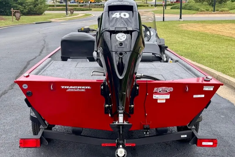 Slide: The Image of 2026 Tracker Bass Tracker Classic XL boat with Mercury 40 engine, red exterior. - 6