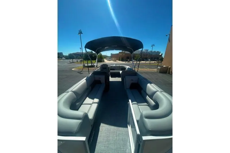 Slide: The Image of 2026 Sun Tracker Party Barge 20 DLX pontoon boat with spacious seating and canopy. - 4