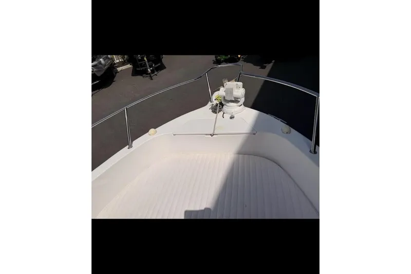 Slide: The Image of 2002 Pro-Line 19 Sport boat deck with railing and equipment. - 1