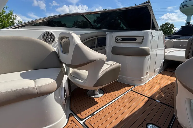 Slide: The Image of 2020 Crownline 290 SS boat interior with seating and wood flooring. - 15