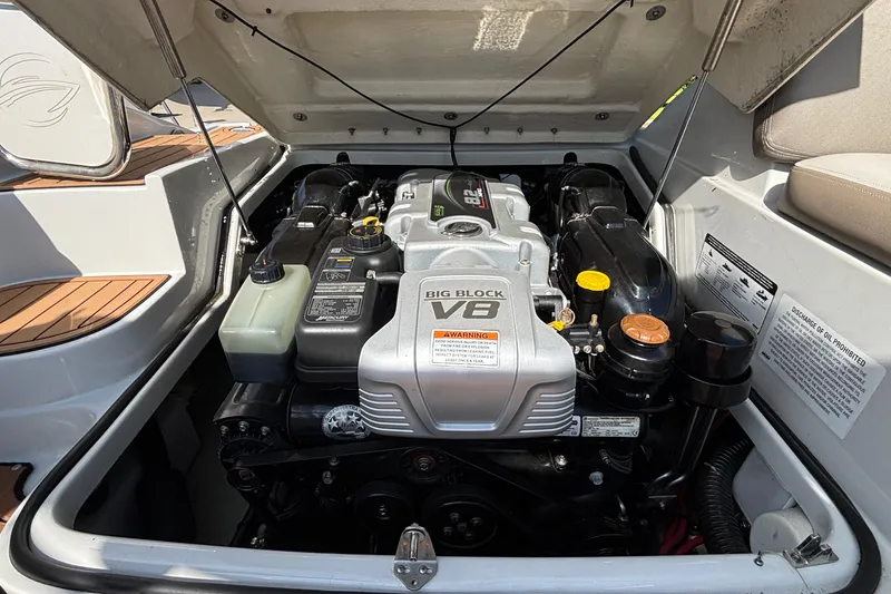Slide: The Image of Engine compartment of a 2020 Crownline 290 SS boat featuring a Big Block V8 engine. - 16