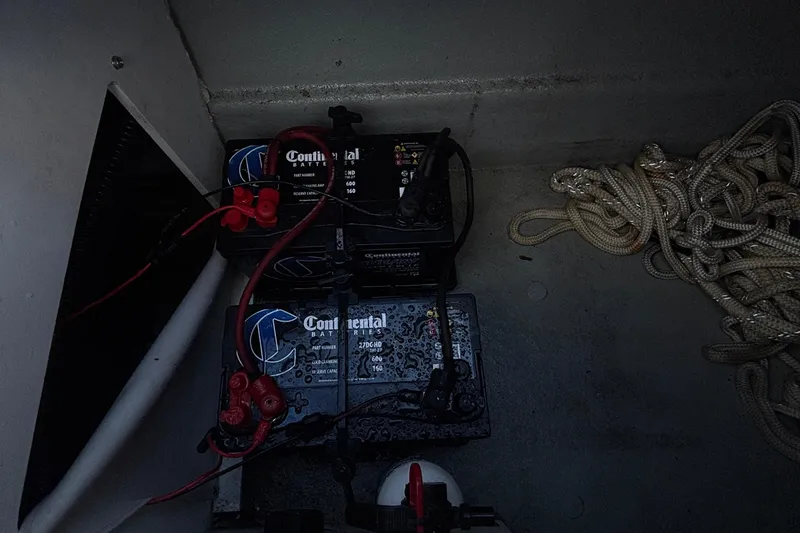 Slide: The Image of Batteries and ropes in a 2020 Crownline 290 SS boat compartment. - 20