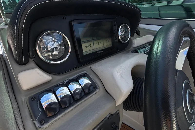 Slide: The Image of Dashboard of a 2020 Crownline 290 SS boat with gauges and controls. - 25