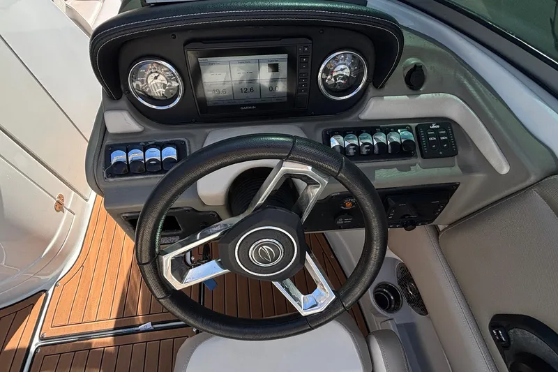 Slide: The Image of Steering console of 2020 Crownline 290 SS boat with modern controls and dashboard. - 27